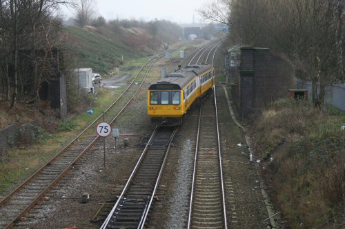 An unusual sight as 142055 crosses over from the 'up' line