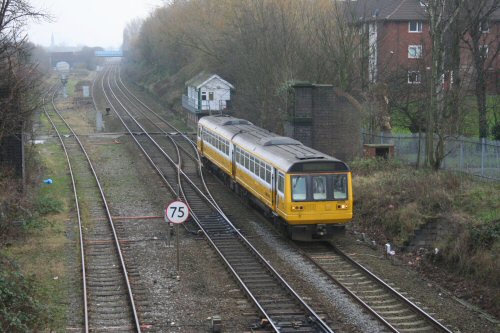 then returns on the 'down' line, passing the remains of Cock Robin footbridge which linked Tan Pit Lane with Devonshire Road until the extension of the M602 in the early 1980s